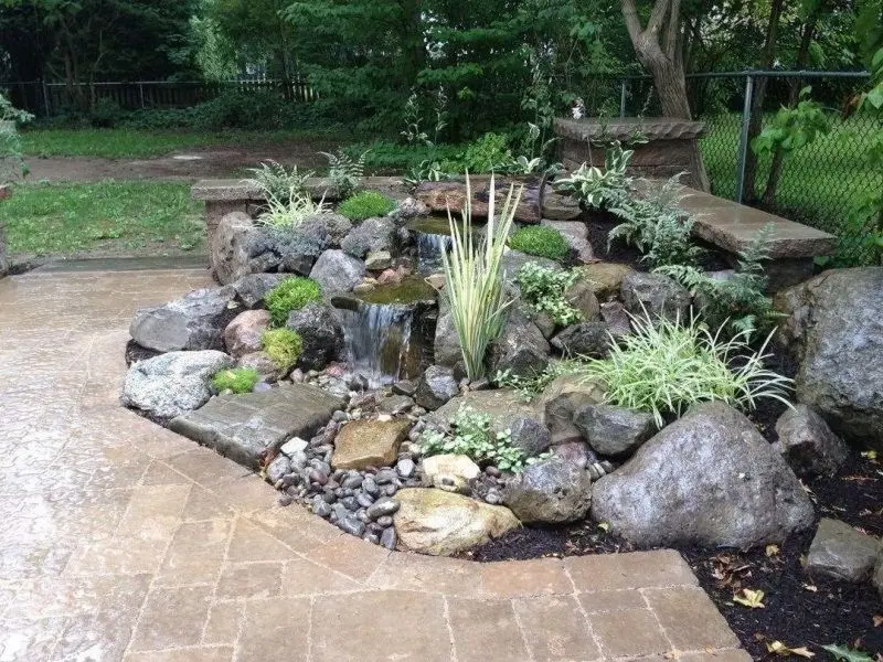 The beautiful natural rockery evokes peaceful beauty in the garden space.